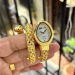 Luxury Snake-Inspired Wrap Watch – Emerald Green & Dual-Tone Finish